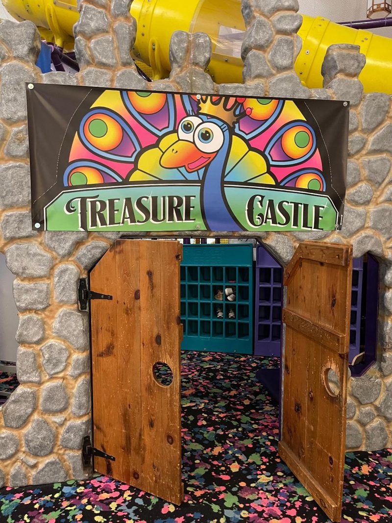 Wooden castle doors at the entrance to the play fortress